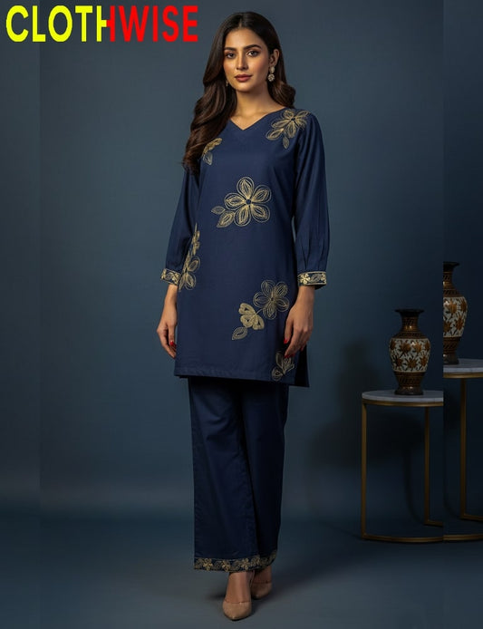Woman wearing a navy blue outfit with floral embroidery, standing against a dark blue background with 'ClothWise' branding.