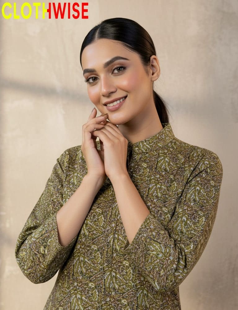 Woman wearing a green patterned dress with 'CLOTHWISE' branding.