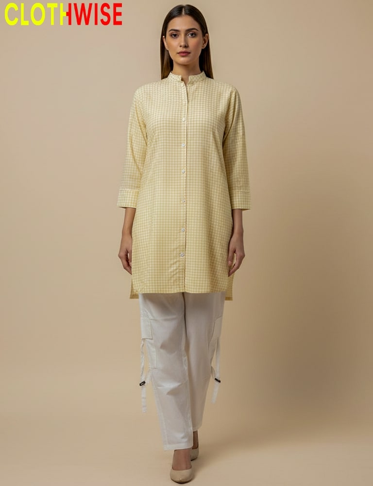 Woman wearing a yellow checkered kurta with white pants on a beige background, branded 'CLOTHWISE'.