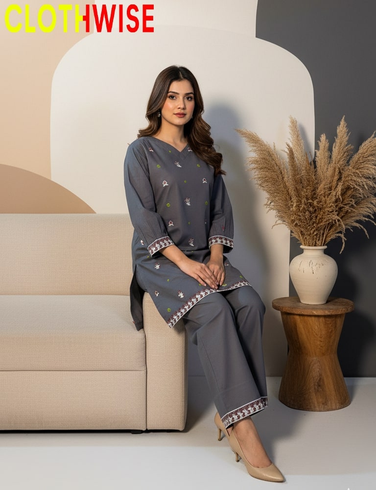 Woman in a gray outfit sitting on a beige sofa with a decorative vase and plant in the background, branded 'CLOTHWISE'.