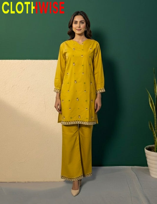 Woman wearing a mustard yellow traditional outfit with 'CLOTHWISE' branding against a green and beige background.