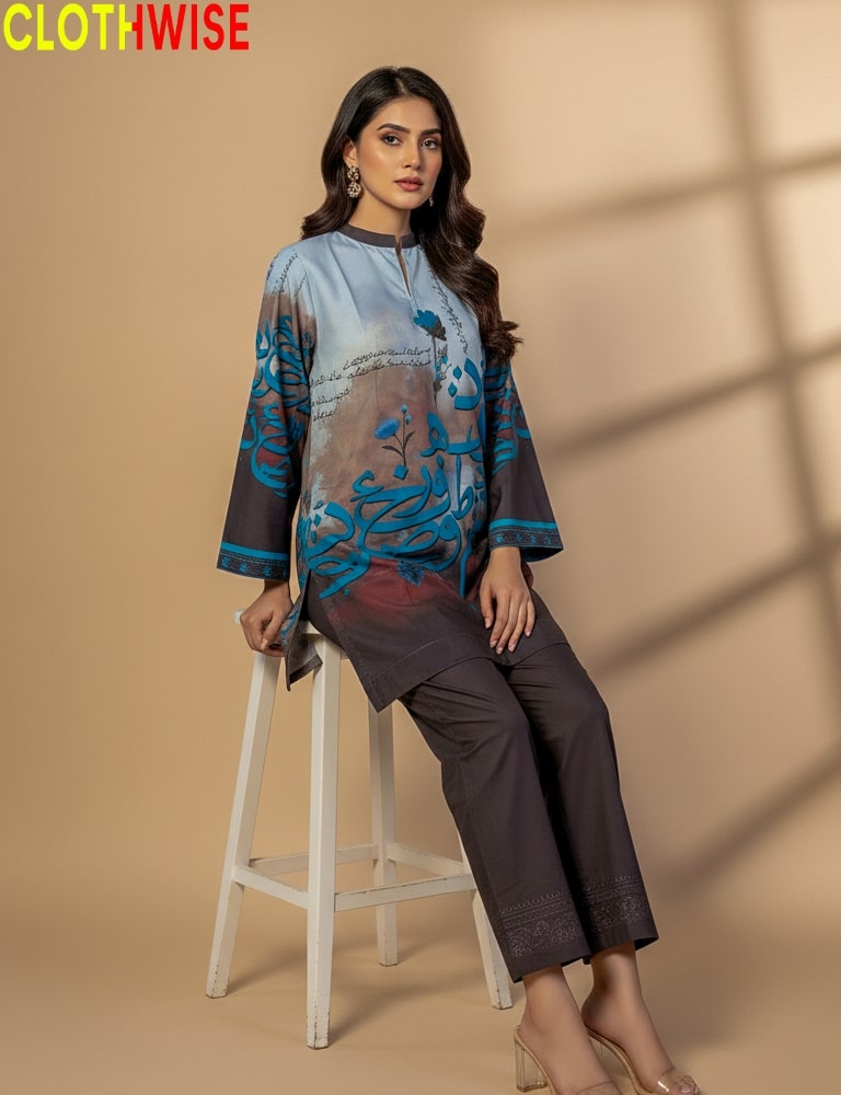 Woman wearing a blue and gray patterned top with brown pants, sitting on a stool against a beige background. Brand 'CLOTHWISE' visible.