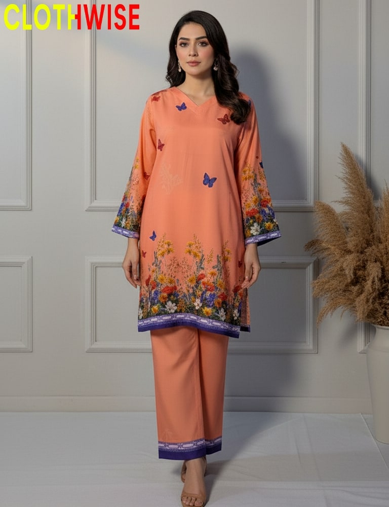 Woman wearing an orange outfit with floral patterns in a minimalistic setting