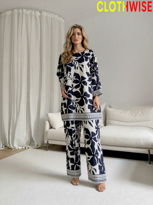 Woman wearing a blue and white patterned outfit in a modern living room setting with 'ClothWise' branding.