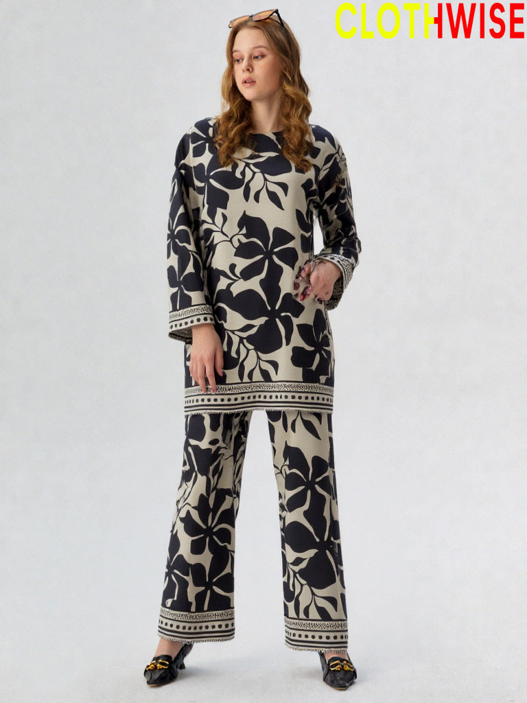 Woman wearing a black and white patterned outfit with 'Clothwise' branding.