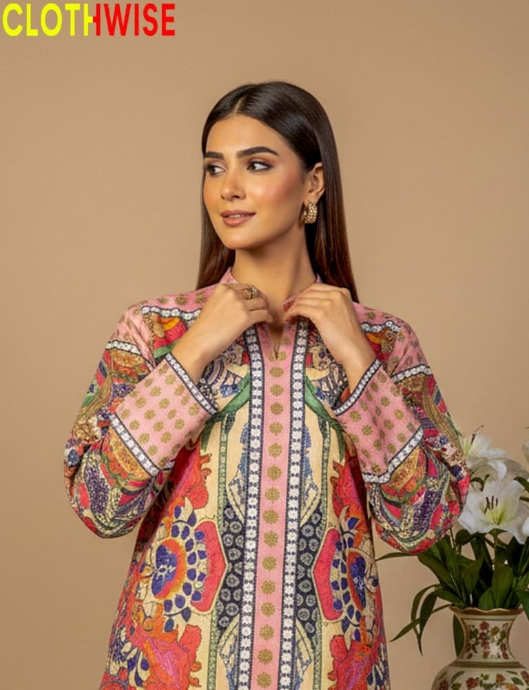 Woman wearing a colorful patterned shirt with 'CLOTHWISE' branding on a beige background.