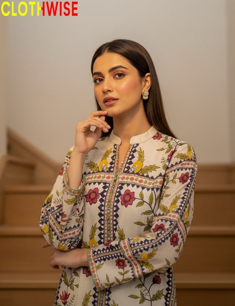 Woman wearing a floral embroidered outfit with 'CLOTHWISE' branding.
