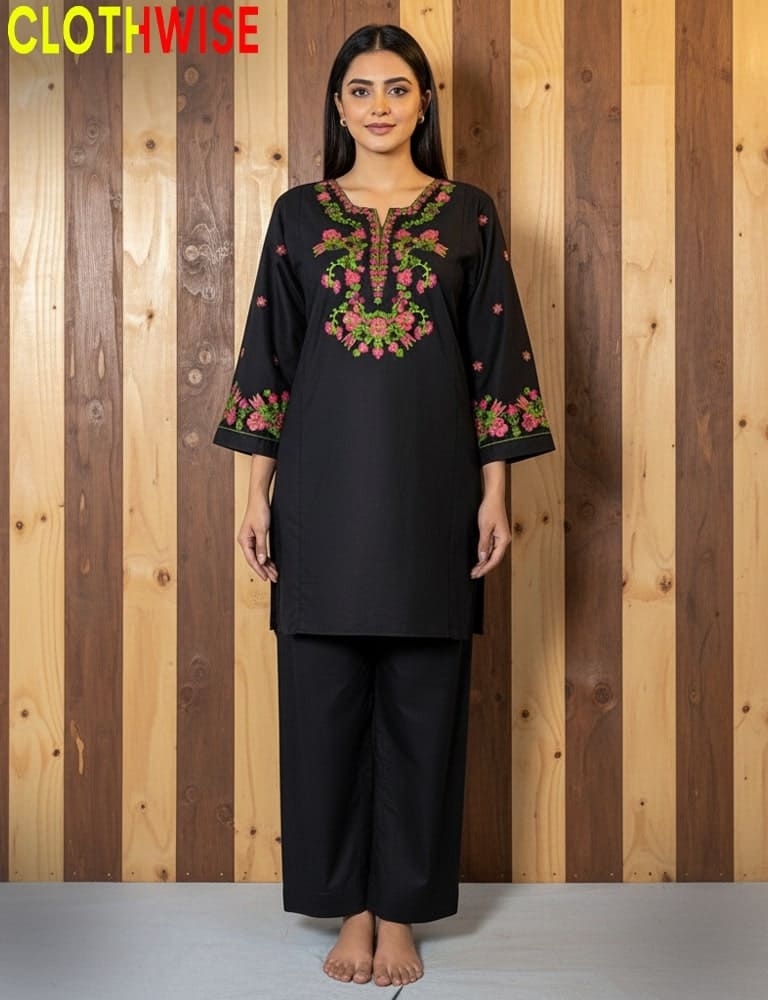 Woman wearing a black embroidered outfit with a wooden striped background, branded 'Clothwise'.