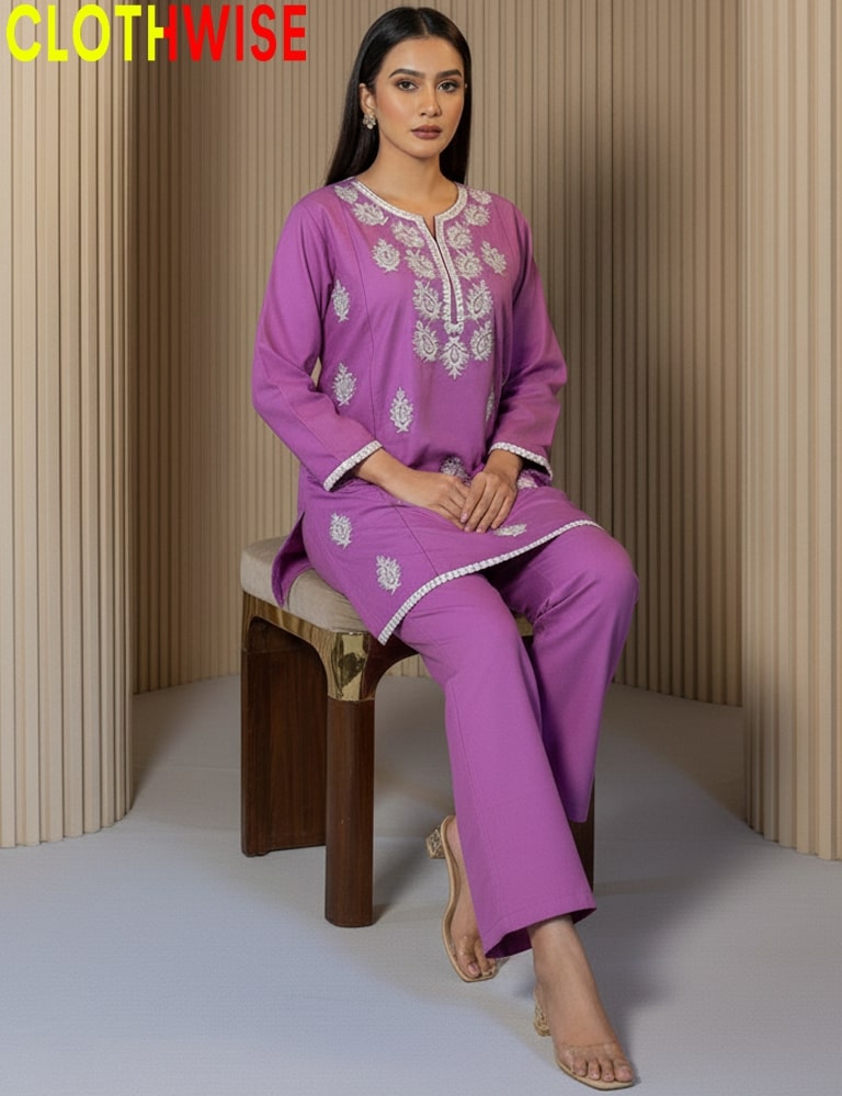 Woman wearing a purple embroidered outfit sitting on a wooden stool against a neutral background with 'CLOTHWISE' branding.