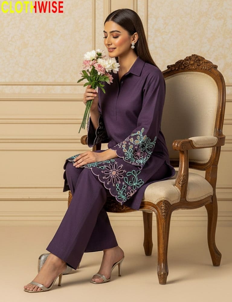 Woman in a purple outfit with floral embroidery sitting on a wooden chair holding flowers, with 'CLOTHWISE' branding.