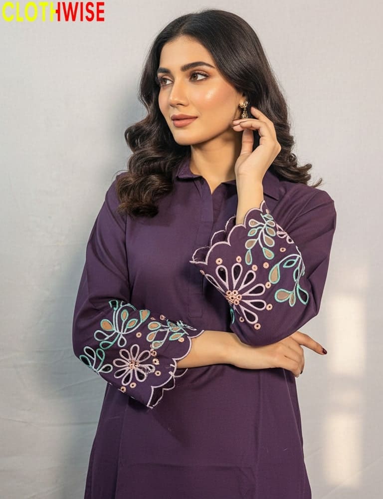 Woman wearing a purple embroidered outfit with 'Clothwise' branding.
