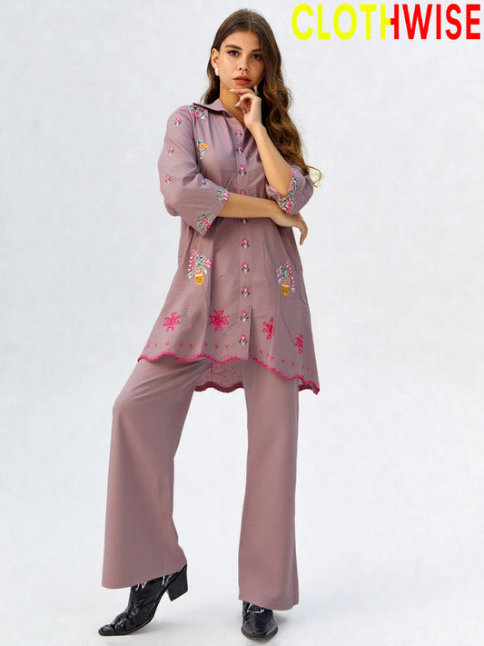 Woman wearing a pink embroidered outfit with 'ClothWise' branding on a white background