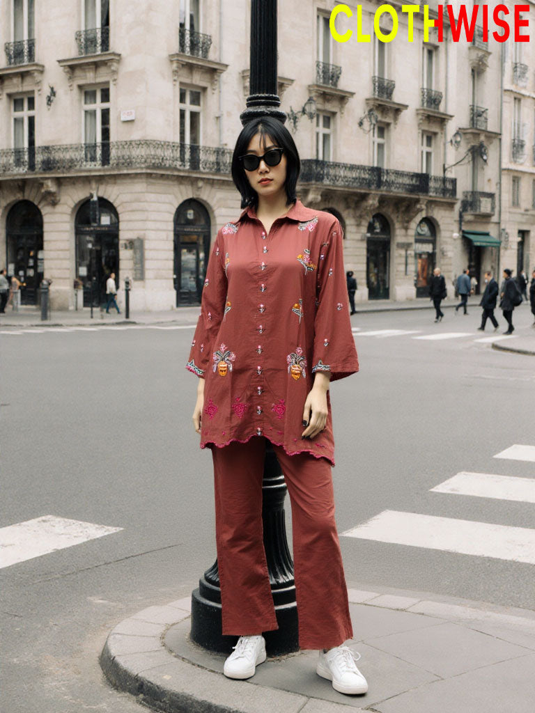 Woman in a red outfit standing on a city street with 'CLOTHWISE' branding.