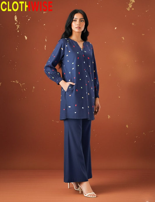 womem wearing embroidered co-ord set by clothwise