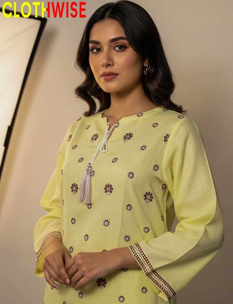 Woman wearing a yellow embroidered kurta with 'CLOTHWISE' branding.
