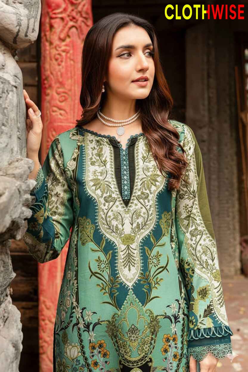 Woman wearing a green and white embroidered dress with 'CLOTHWISE' branding.