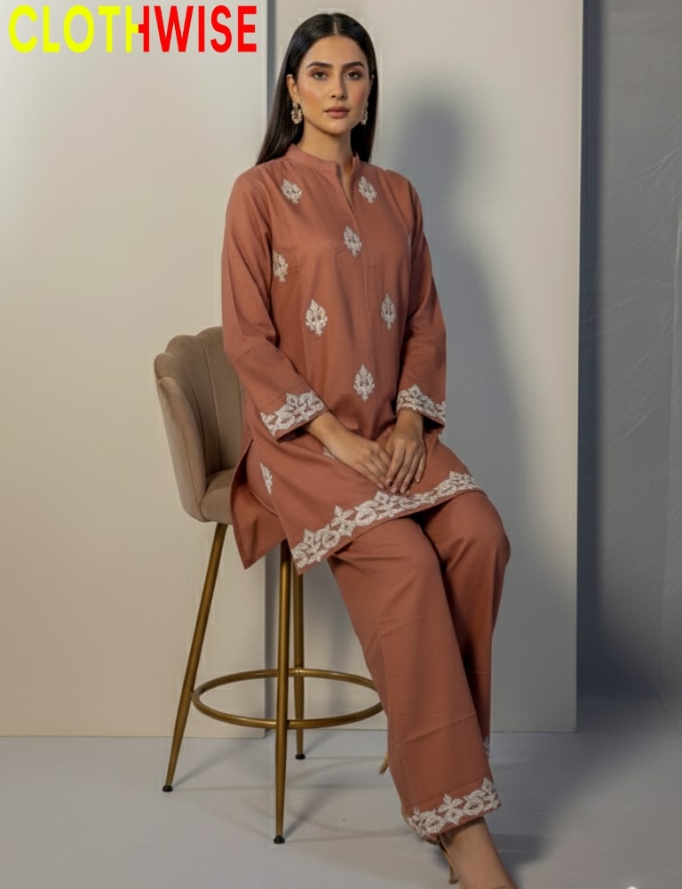 Woman sitting on a chair wearing a brown outfit with lace details, branded 'CLOTHWISE'.