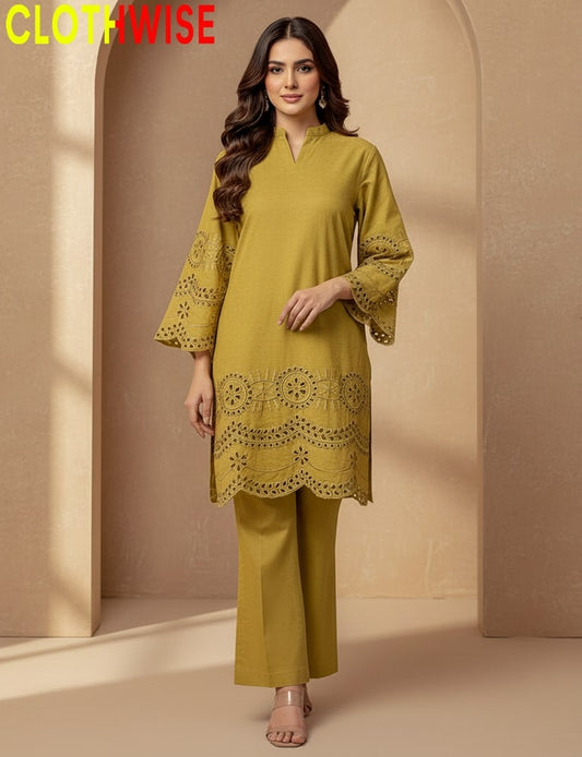 Woman wearing a mustard yellow outfit with lace details, standing against a beige background with 'CLOTHWISE' branding.