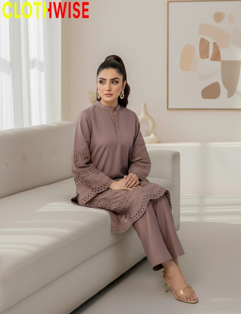 Woman sitting on a couch wearing a matching outfit with 'CLOTHWISE' branding.
