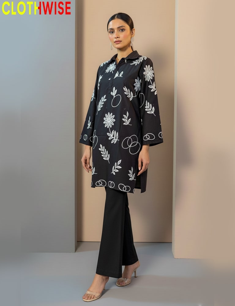 Woman wearing a black floral patterned top and black pants with 'CLOTHWISE' branding.