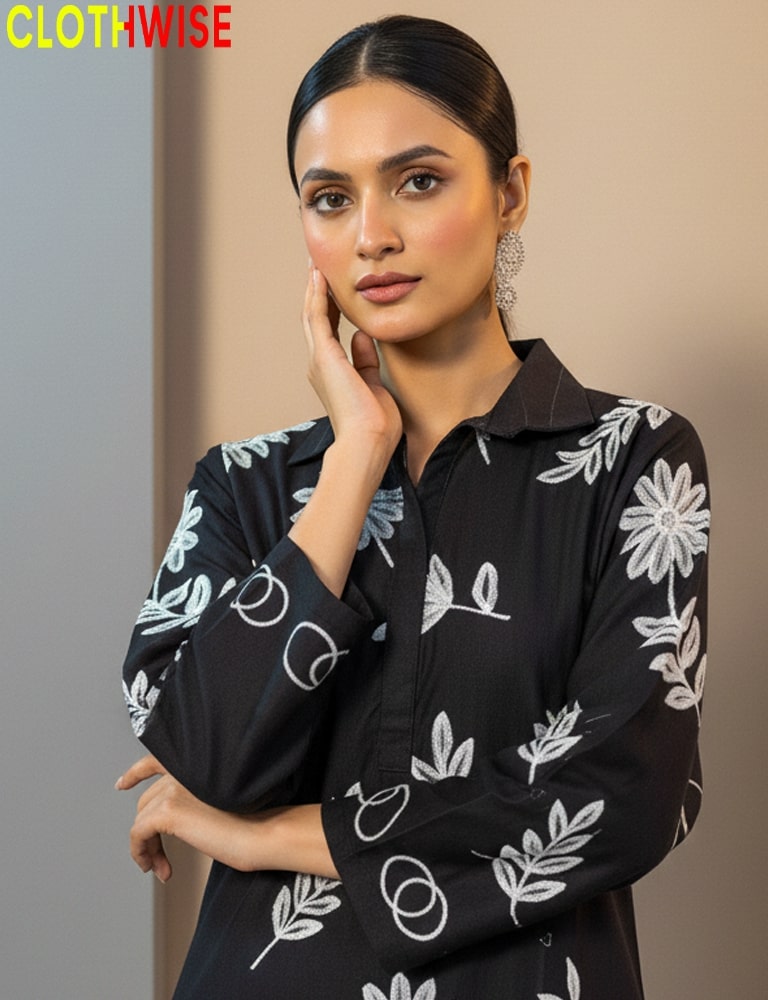 Woman wearing a black floral patterned shirt with 'CLOTHWISE' branding.