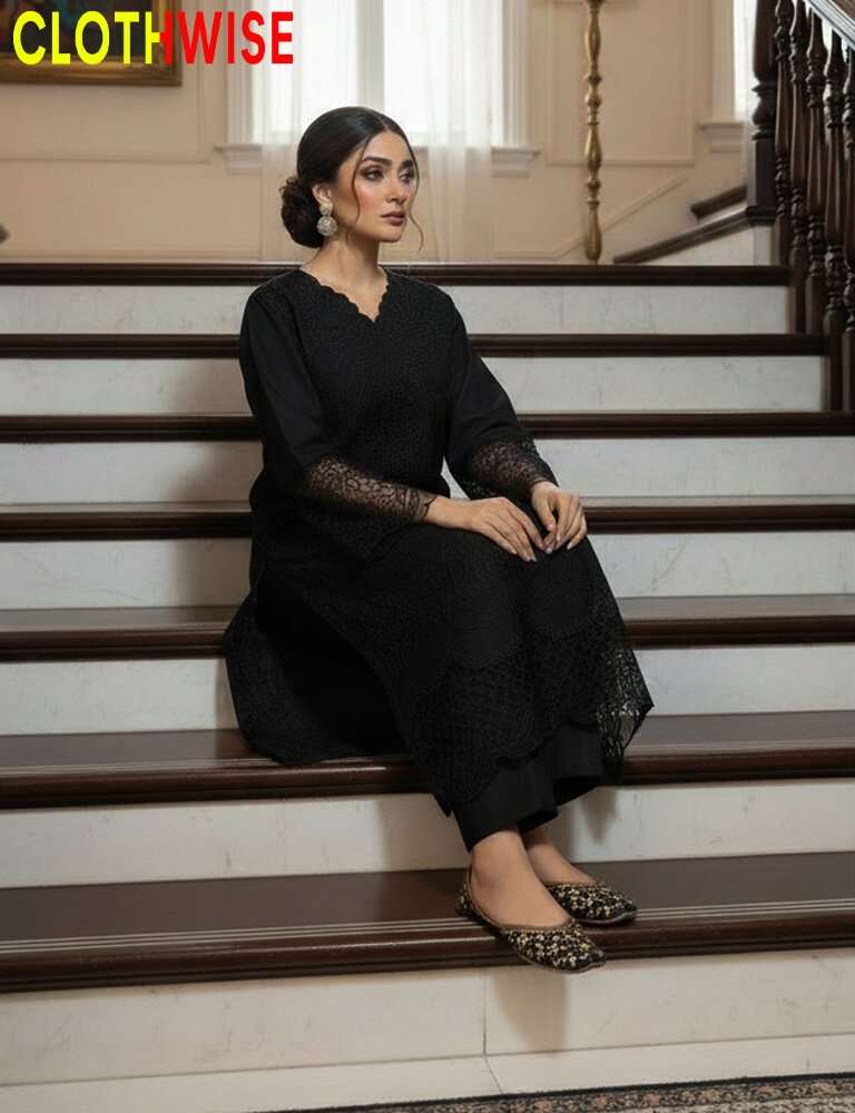 Woman in a black outfit sitting on stairs with 'CLOTHWISE' branding.