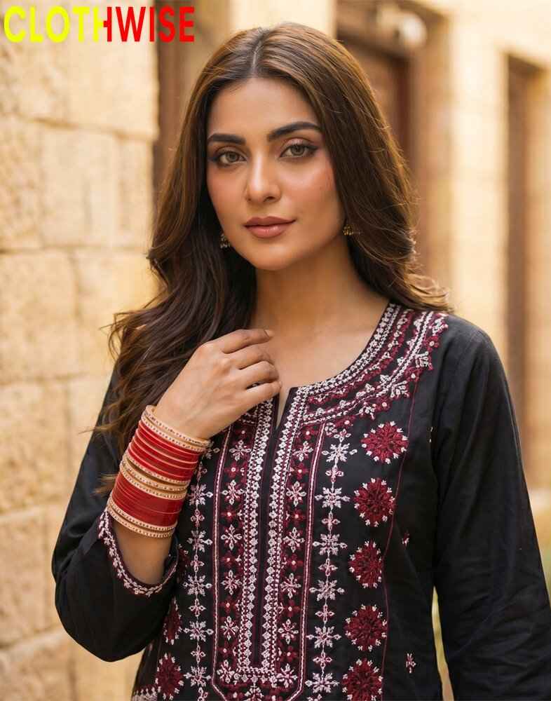 Woman wearing a black and red embroidered traditional outfit with 'CLOTHWISE' branding.