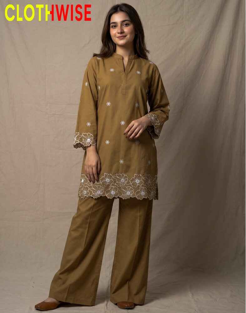 Woman wearing a brown traditional outfit with lace details on a beige background, branded 'Clothwise'.