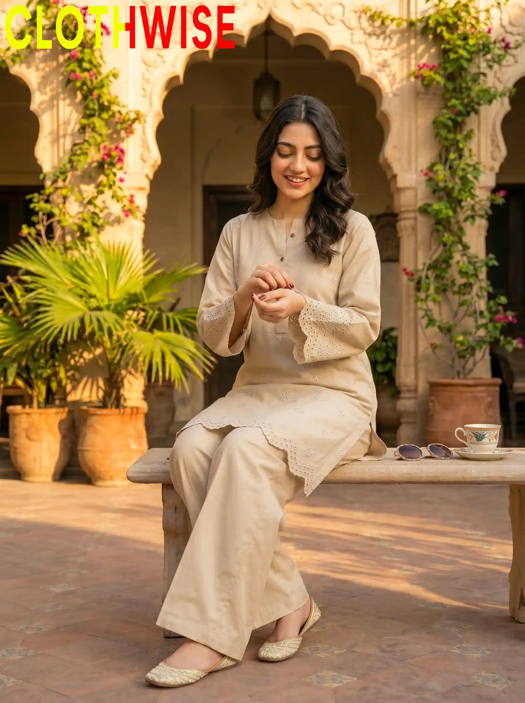 Tabeer Skin suit sitting pose showing flapper bottom and chikankari embroidery detail | Clothwise