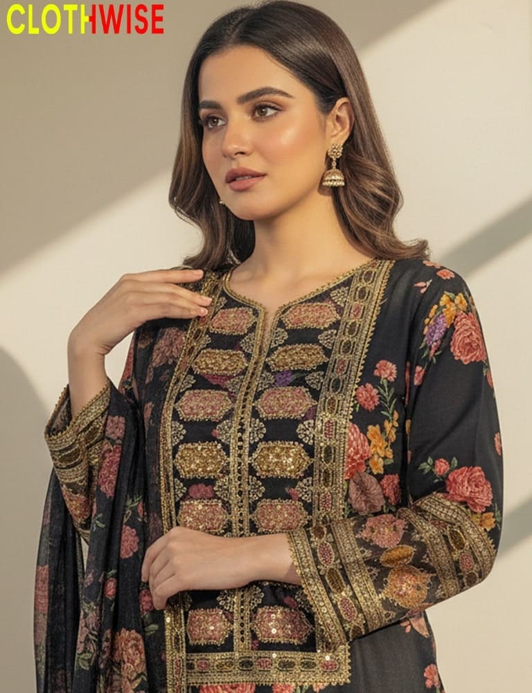 Woman wearing a black embroidered traditional outfit with 'ClothWise' branding.
