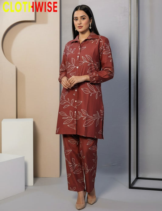 Woman wearing a red floral outfit with 'Clothwise' branding in the corner.