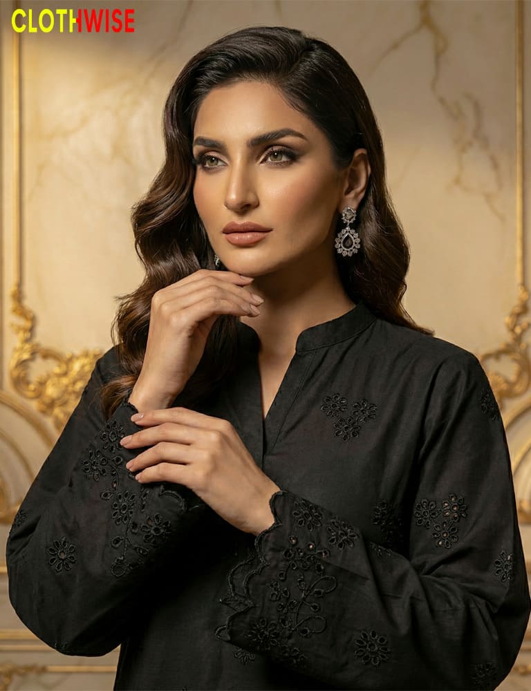 Woman wearing a black embroidered outfit with 'Clothwise' branding in the corner.