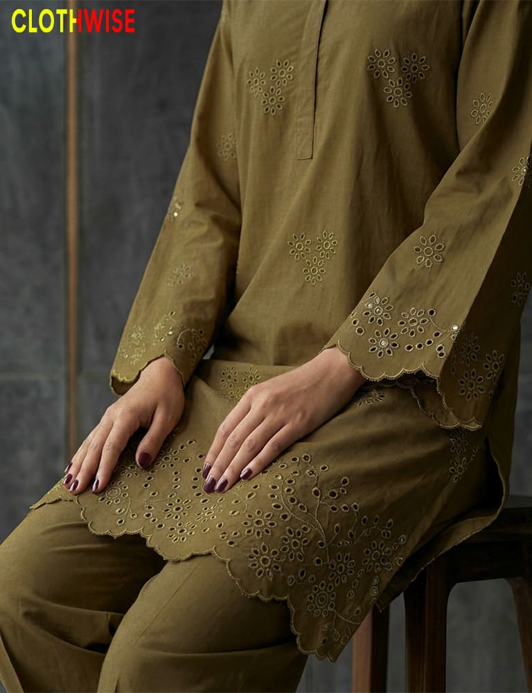 Person wearing a brown embroidered outfit with 'CLOTHWISE' branding.