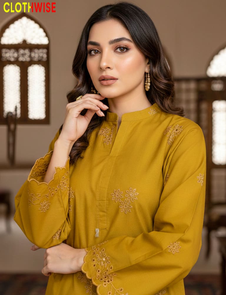 Woman wearing a mustard yellow embroidered kurta with a blurred background