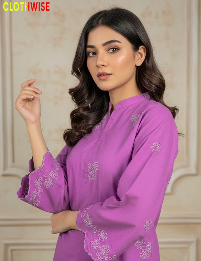 Woman wearing a purple embroidered outfit with a neutral background, featuring the brand 'Clothwise'.
