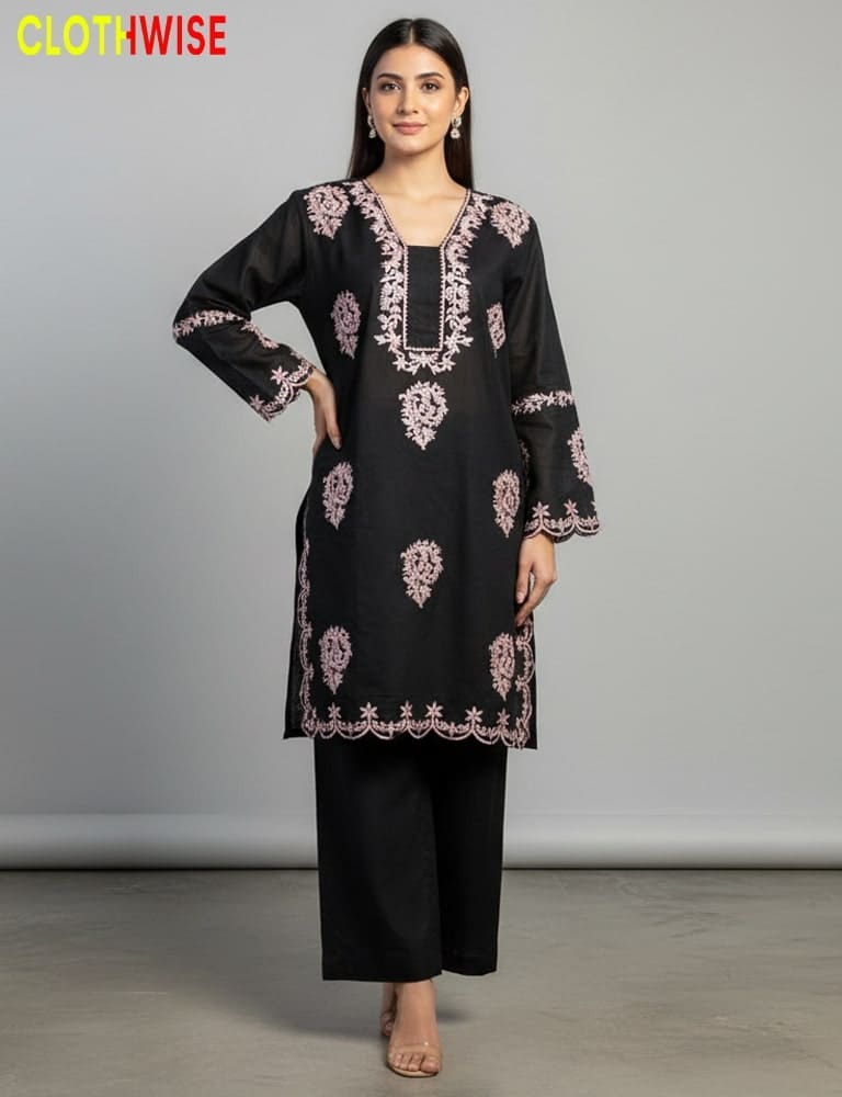 Woman wearing a black embroidered kurta with pink patterns on a gray background, branded 'ClothWise'.