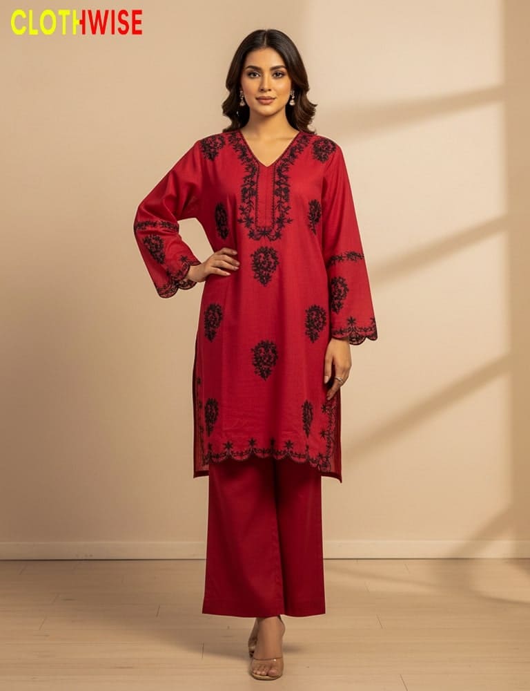Woman wearing a red embroidered outfit with a beige background, featuring the 'ClothWise' brand.