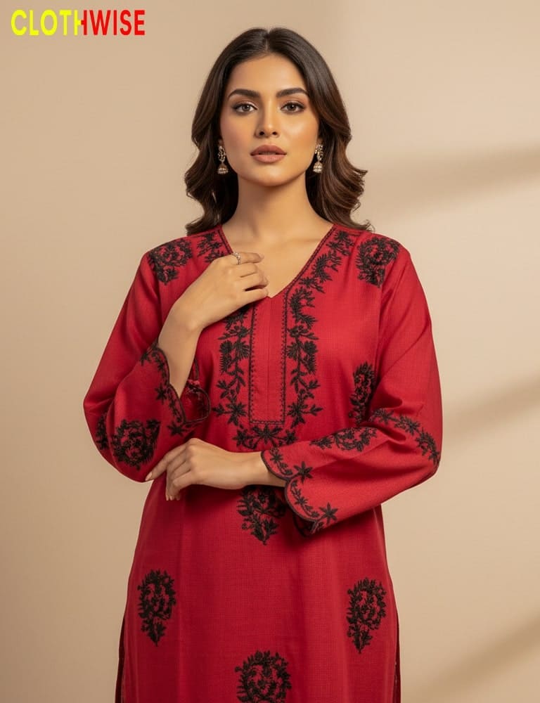 Woman wearing a red embroidered dress with a beige background, featuring the 'ClothWise' brand.
