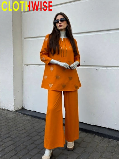 Woman wearing an orange outfit with a white wall background, branded 'CLOTHWISE'.