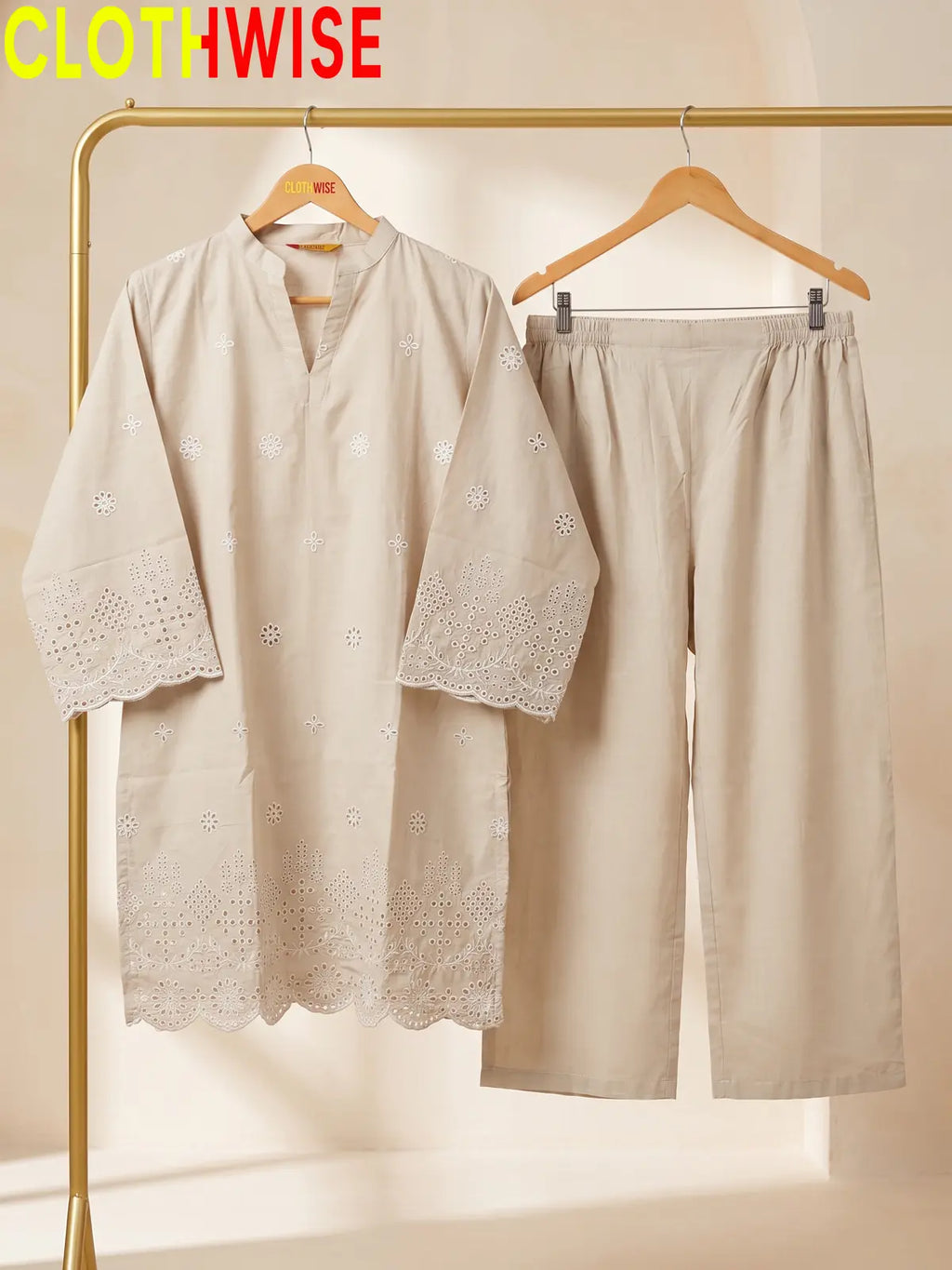 beige colour dress hang on hanger

