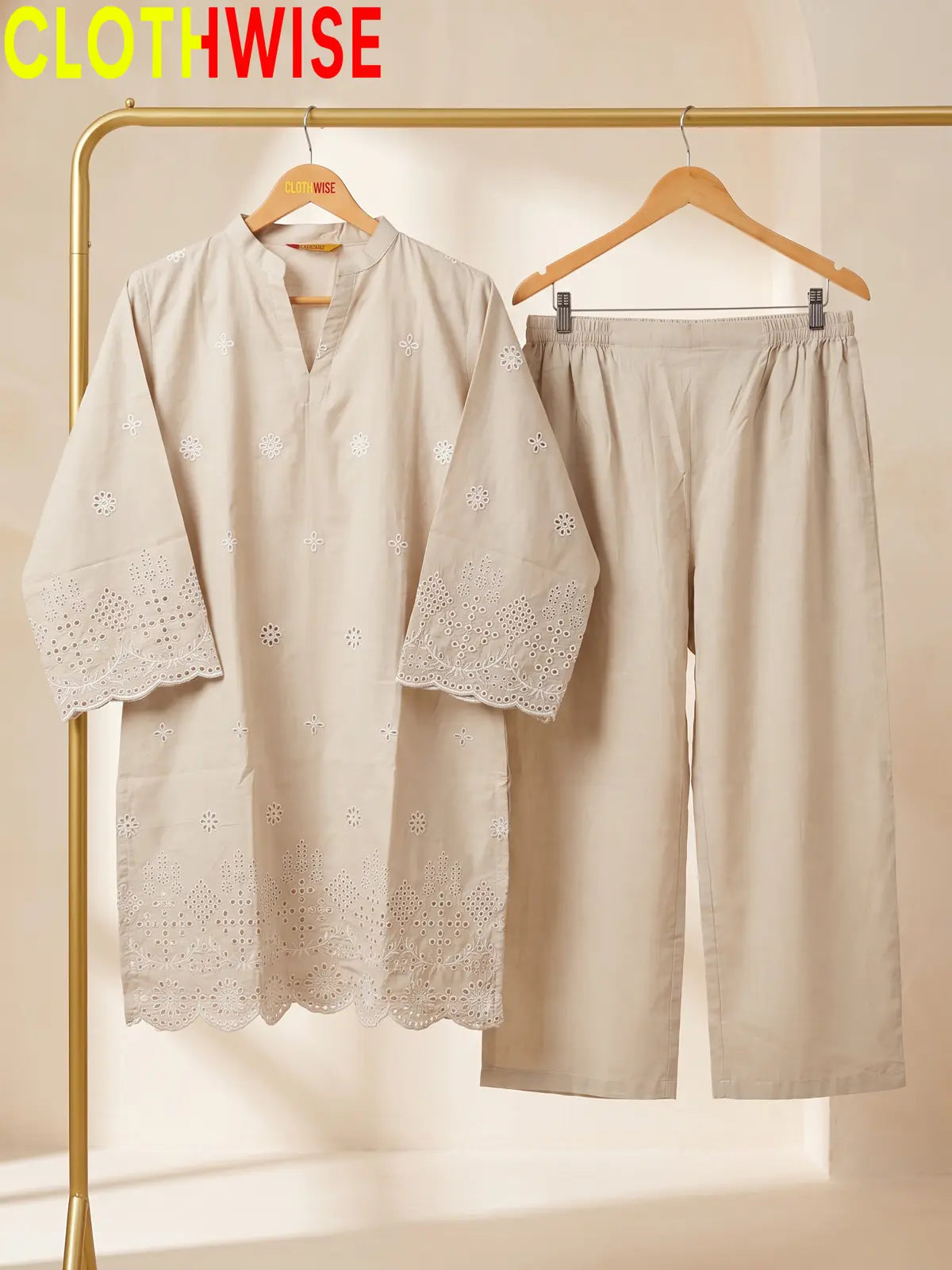 beige colour dress hang on hanger
