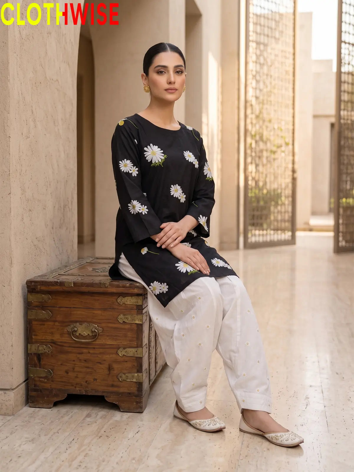 Daisy Black embroidered cotton suit - sitting view - CLOTHWISE