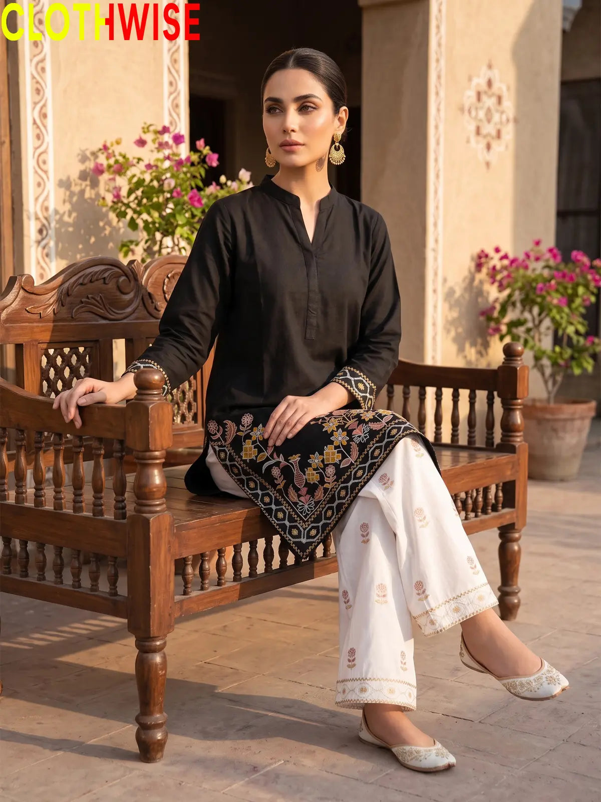 Shajar Black embroidered cotton suit sitting pose
