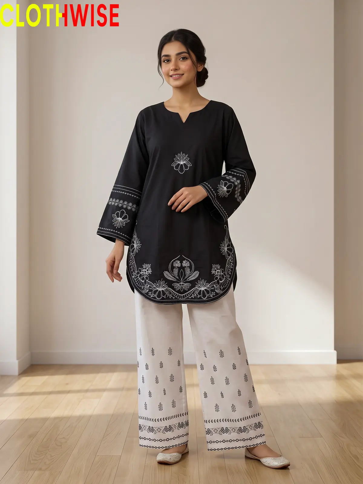 Petal embroidered cotton co-ord set in black - front standing view