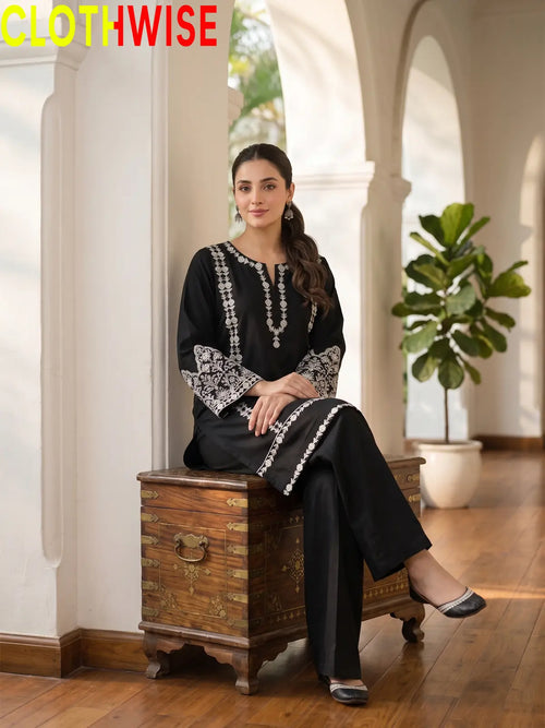 women wear a black 2pice sit by clothwise