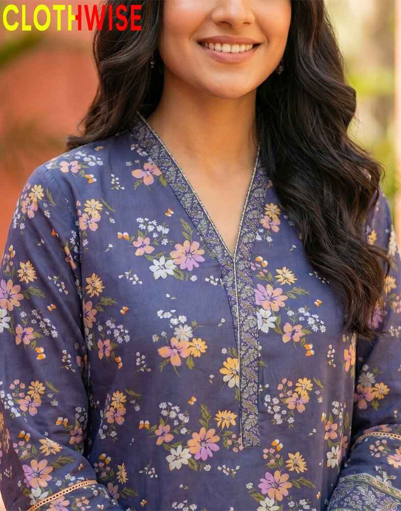 Woman wearing a blue floral patterned shirt with 'CLOTHWISE' branding.