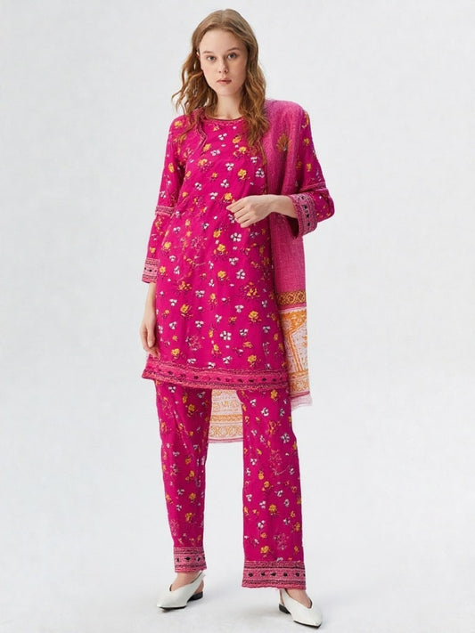 Woman wearing a pink traditional outfit with floral patterns on a white background