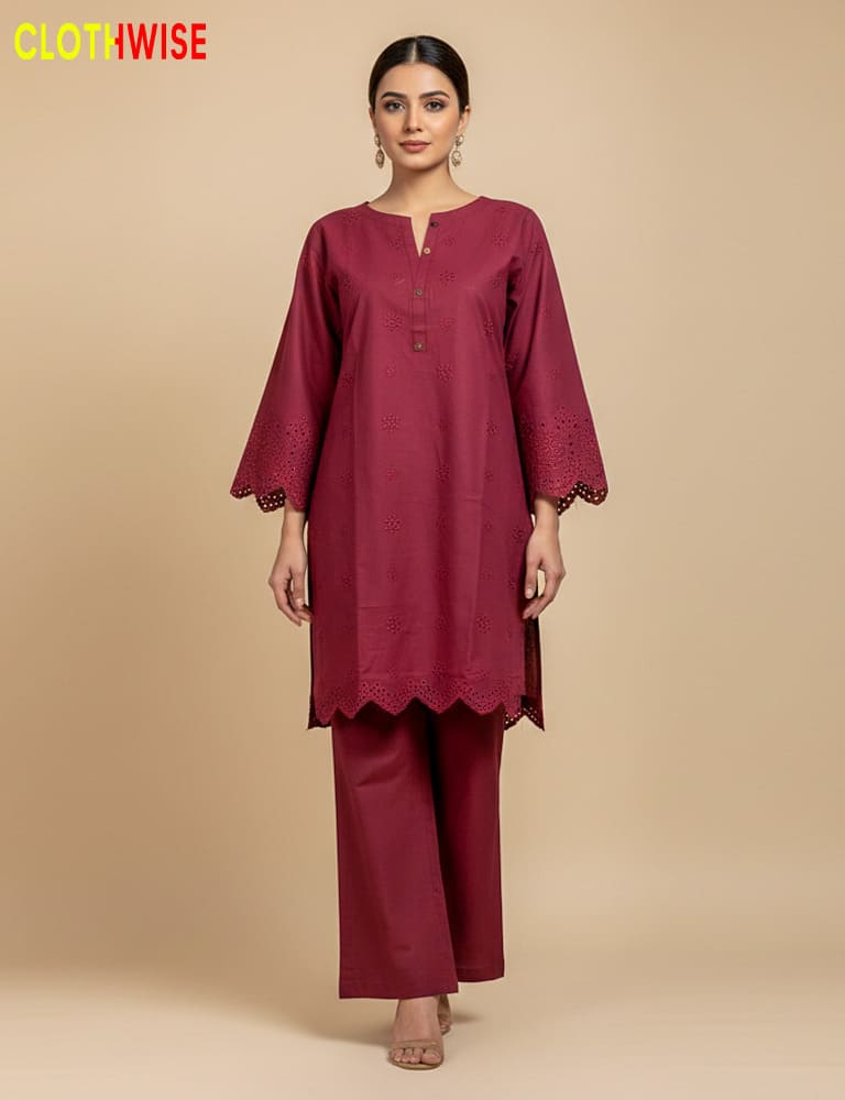 Woman wearing a maroon kurta with lace details on a beige background, branded 'Clothewise'.