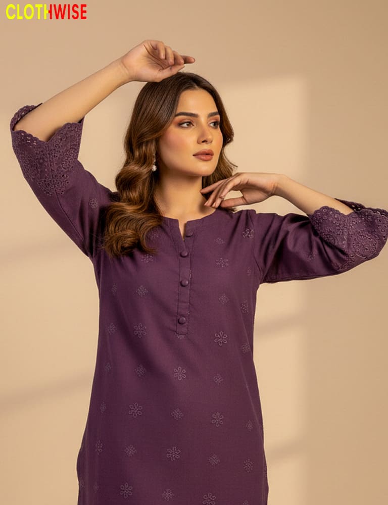 Woman wearing a purple kurta with intricate patterns on a beige background, with 'Clothewise' branding.