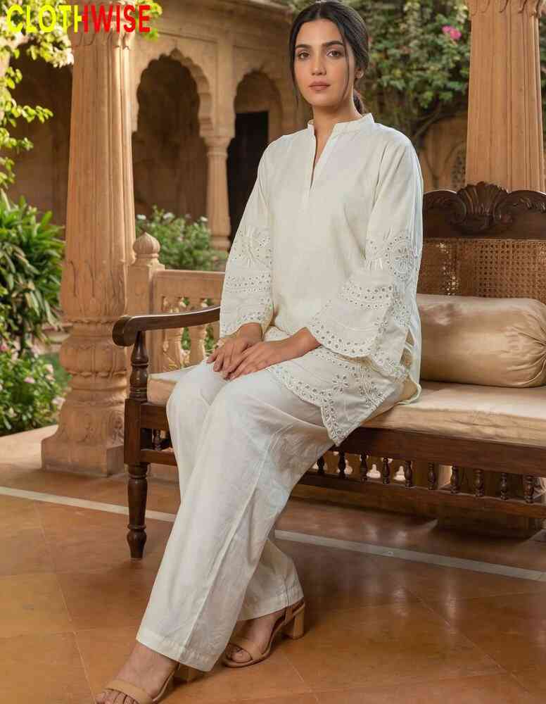 Woman in a white outfit sitting on a wooden bench with 'CLOTHWISE' branding.